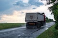 Truck vehicle driving wet road in rainy weather Royalty Free Stock Photo