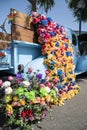 A truck with a vibrant display of colorful flowers