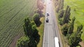 Truck, wagon and car driving on the highway, aerial. Transport logistics background Royalty Free Stock Photo