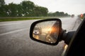 Truck in a rear view mirror at sunset Royalty Free Stock Photo