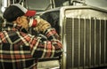 Trucker Driver Drinking a Coffee Next to His Semi Truck Royalty Free Stock Photo