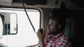 Trucker Preparing For Trip. Black Men Talking on CB Radio. Truck Driver Job