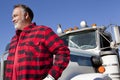 Trucker standing in front of Cargo truck Royalty Free Stock Photo