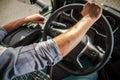 Truckers Hand on a Semi Truck Steering Wheel Close Up Photo Royalty Free Stock Photo