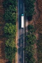 Trucking and freight transport logistic concept, aerial shot of semi-truck on highway from drone pov Royalty Free Stock Photo