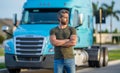 Trucking owner. hispanic man posing in front of truck. Semi trucks vehicle. man driver near lorry truck. Man owner truck Royalty Free Stock Photo