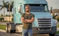 Trucking owner. hispanic man posing in front of truck. Semi trucks vehicle. man driver near lorry truck. Man owner truck Royalty Free Stock Photo