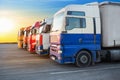 trucks on the asphalt on the background of a beautiful sunny sky Royalty Free Stock Photo