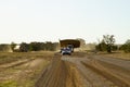 Trucks with a big load and road escorts.