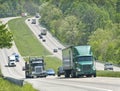 Trucks and traffic on hilly highway