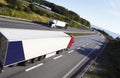 Trucks driving a beautyful freeway route