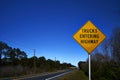 Trucks entering Highway warning sign and highway