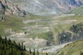 Trucks going from Sary-Moinok pass. Kyrgyzstan Royalty Free Stock Photo