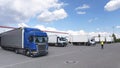 Trucks loading at a depot of a forwarding agency - Transport and logistics in goods trade