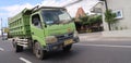 trucks making local commercial delivery at urban city and on the city streets in asia logistical transport system