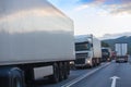 Trucks move in opposite directions on a suburban highway