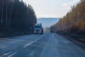 Trucks move on a suburban highway in the winter Royalty Free Stock Photo