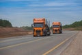 Trucks moving along the suburban highway Royalty Free Stock Photo