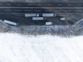 Trucks parked near the road in the parking lot. Winter landscape top view. Copy space on white snow. Royalty Free Stock Photo