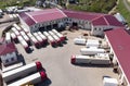 Trucks are in the parking lot of a trucking company. View from above