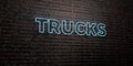 TRUCKS -Realistic Neon Sign on Brick Wall background - 3D rendered royalty free stock image