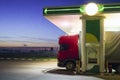 Trucks refuel at the gas station at night Royalty Free Stock Photo