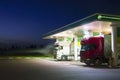 Trucks refuel at the gas station at night Royalty Free Stock Photo