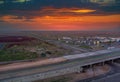 Trucks at rest area in a crowded parking lot off the highway with refueling car on gas station on sunset in the USA Royalty Free Stock Photo