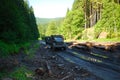 Trucks ride on a mountain forest road. Dirty road after the rain. Off-road Royalty Free Stock Photo