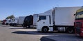 Trucks and Semi Trailer Trucks the Parking lot. Delivery Trucks. Cargo Shipping. Lorry. Industry Freight Truck Logistics