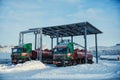 Trucks at the tank farm. Oil pipeline. Winter concept