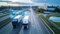 Trucks on Highway with Digital Data Visualizations and Cityscape in Background transportation Royalty Free Stock Photo