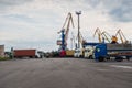 Trucks waiting in line at the port of transhipment. Royalty Free Stock Photo