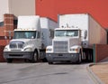 Trucks at warehouse loading dock Royalty Free Stock Photo