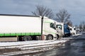 Trucks in winter at a rest area on the highway Royalty Free Stock Photo