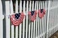 American flag banners on white picket fence, america the beautiful Royalty Free Stock Photo