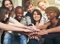 The true definition of a team. Low angle shot of a group of young colleagues with their hands in a huddle. Royalty Free Stock Photo