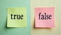 True, false words written on colorful sticky notes on split background. Concept of decision making, judgment, choosing between Royalty Free Stock Photo