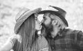 True feelings. Enjoying life. Love and harmony. Bearded cowboy in hat kissing adorable girlfriend. Couple in love