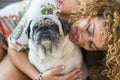 True love between beautiful caucasian woman and old dog pug, Odd friends and family alternative concept. cheerful lady and smile