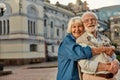 True love has no expiration date. Portrait of cheerful senior couple in casual clothing embracing each other and looking Royalty Free Stock Photo