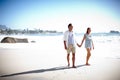 True love lasts a lifetime. A happy mature couple taking a relaxing stroll on the beach together. Royalty Free Stock Photo