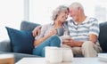 True love never retires. a senior couple enjoying a relaxing coffee break on the sofa at home.