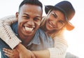 True love is the ride of a lifetime. a happy young couple enjoying a piggyback ride outdoors.