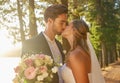 True loves kiss. an affectionate bride and groom outside on their wedding day. Royalty Free Stock Photo