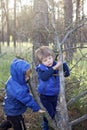 True men friendship, outing of crowed places. Two kids giving high five each other for support Royalty Free Stock Photo