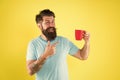 True specialty coffee is becoming big business. Energy concept. Hipster barista yellow background. Coffee shop. Bearded