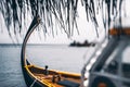 Tiltshift view of a colorful boat near a warf