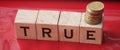True word on wooden cubes on red. True or false facts, real and fake news concept Royalty Free Stock Photo