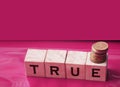 True word on wooden cubes on red. True or false facts, real and fake news concept Royalty Free Stock Photo